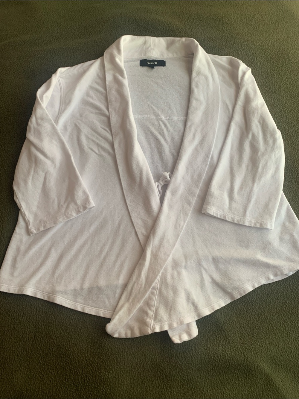 GUC Hurley white 3/4 sleeve, tie front sweater. Size medium.